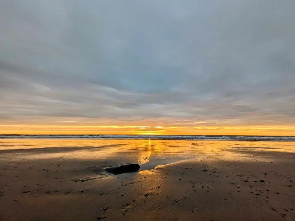 Orangey sunrise reflecting in the sea