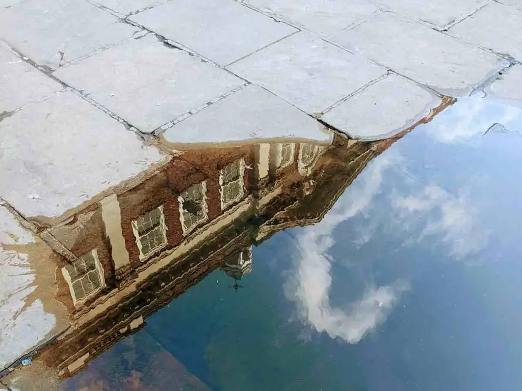 Reflection in a puddle of Bettys York building