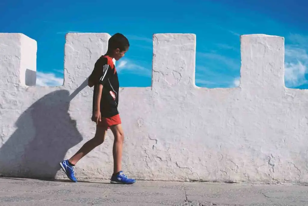 Child running on a castle rooftop